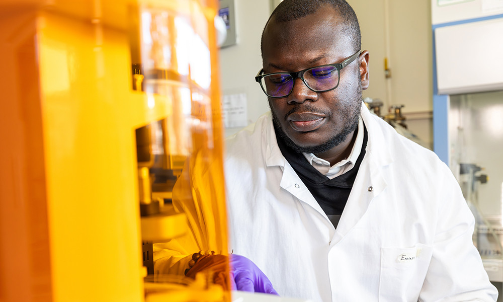 A researcher works with lab tissues in his research lab. 